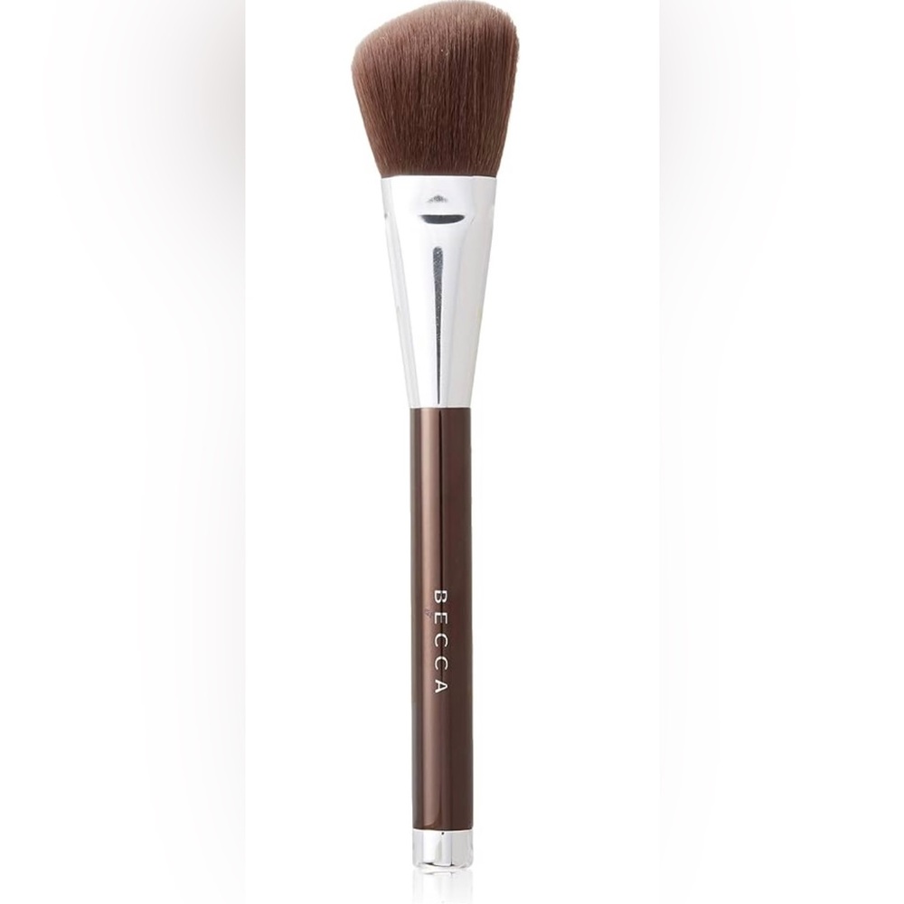 BRAND NEW WITH TAGS BECCA ANGLED HIGHLIGHTING BRUSH. Brown color.